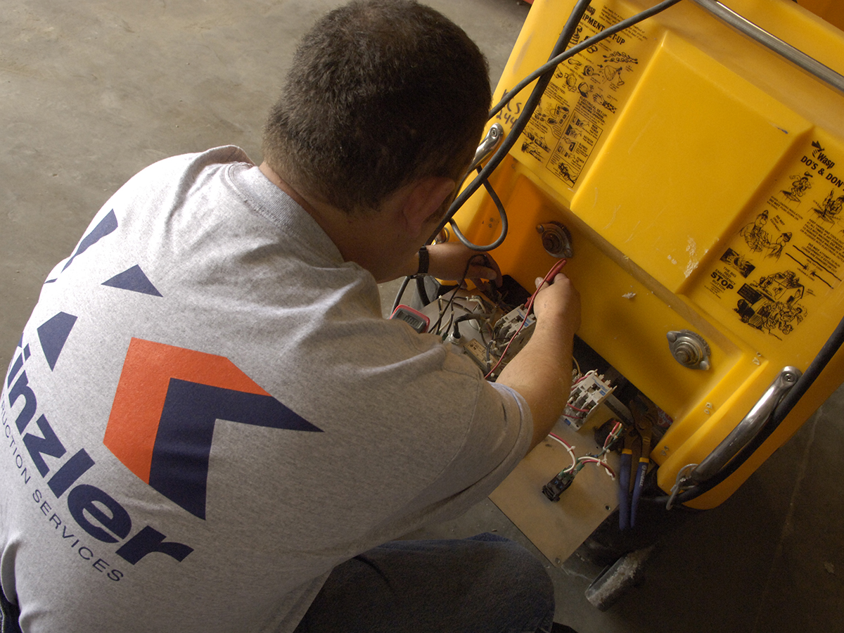 Employee repairing a blower